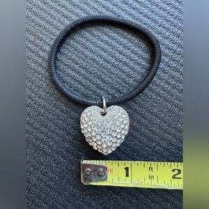 Hair accessory with rhinestones and cutout double-sided heart.